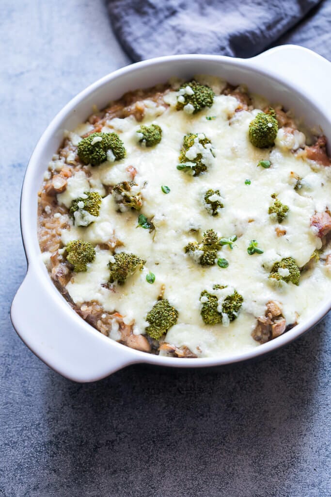 Broccoli chicken rice casserole in white dish.