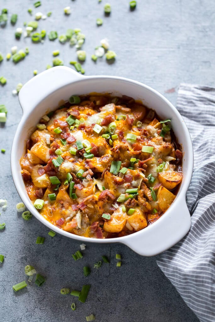 Buffalo chicken casserole in white bowl.