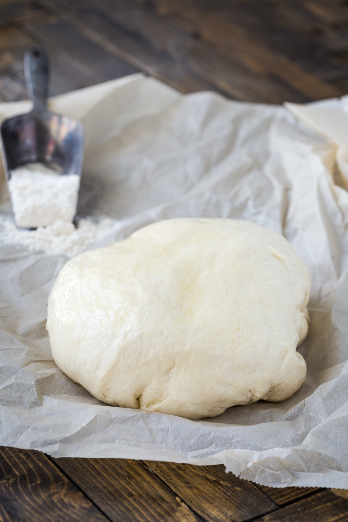 Homemade Naan dough on wax paper.