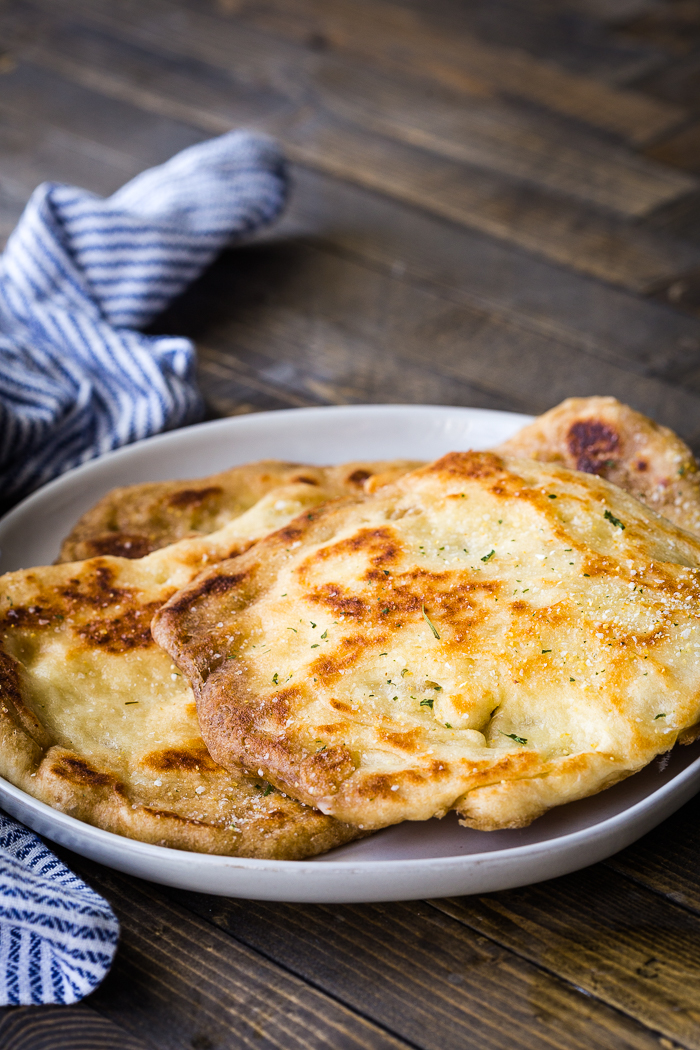 Flatbread Naan on white plate.