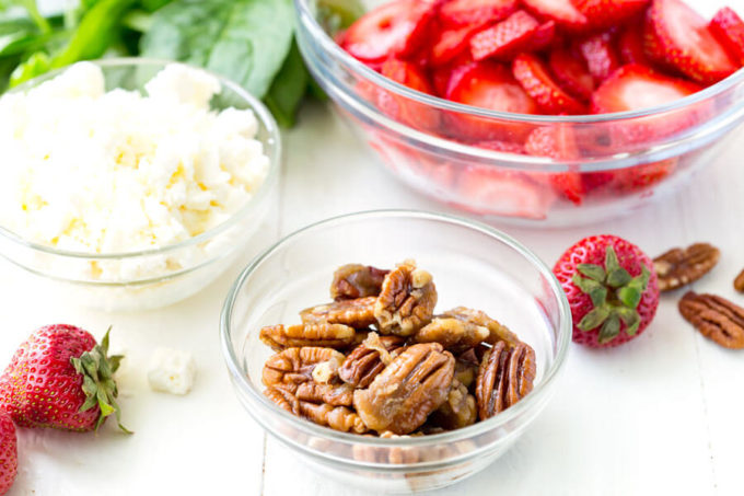 Fresh ingredients in Strawberry Pecan Spinach Salad with a balsamic vinaigrette