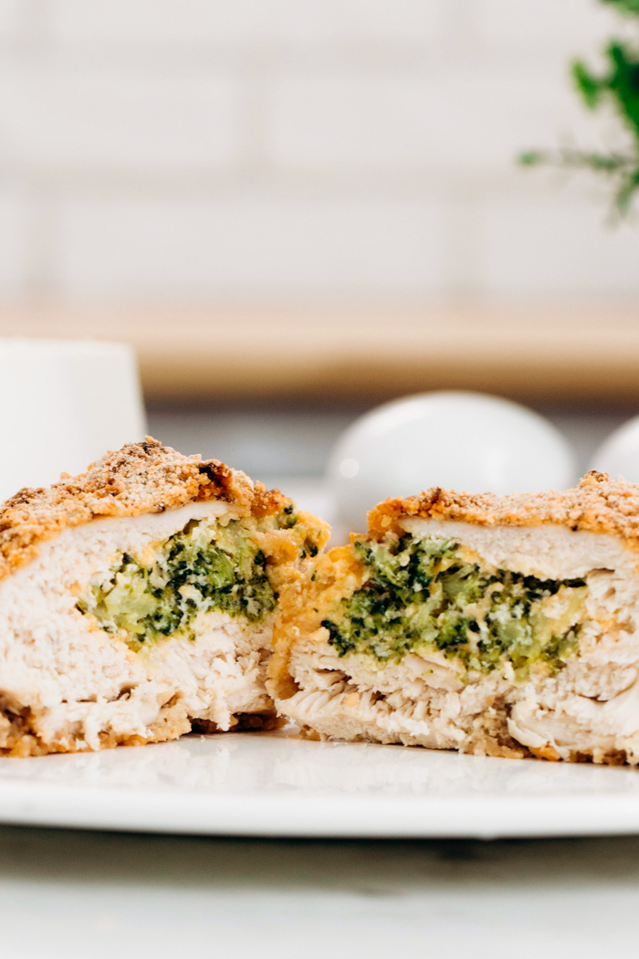 Broccoli Cheese Stuffed Chicken Breasts on a white plate with a panko breading