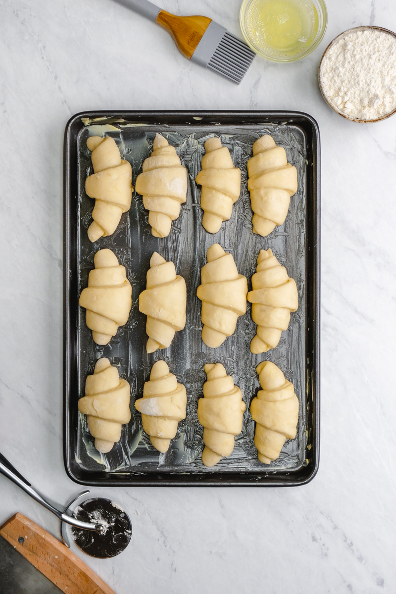 A sheet pan with uncooked crescent rolls