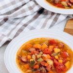 Beef and vegetable soup in a white bowl