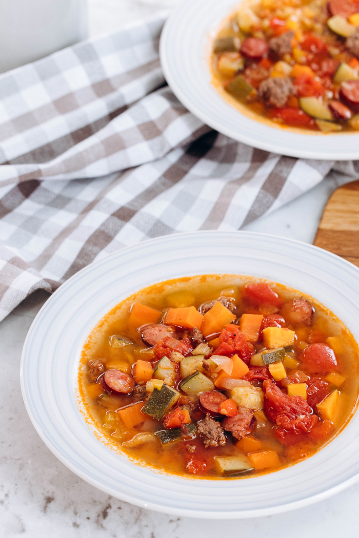 Beef and vegetable soup in a white bowl