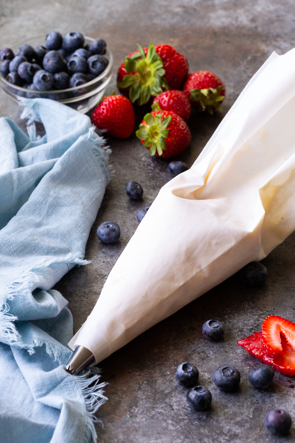 Piping bag with cream cheese mixture for festive breakfast pastry. 