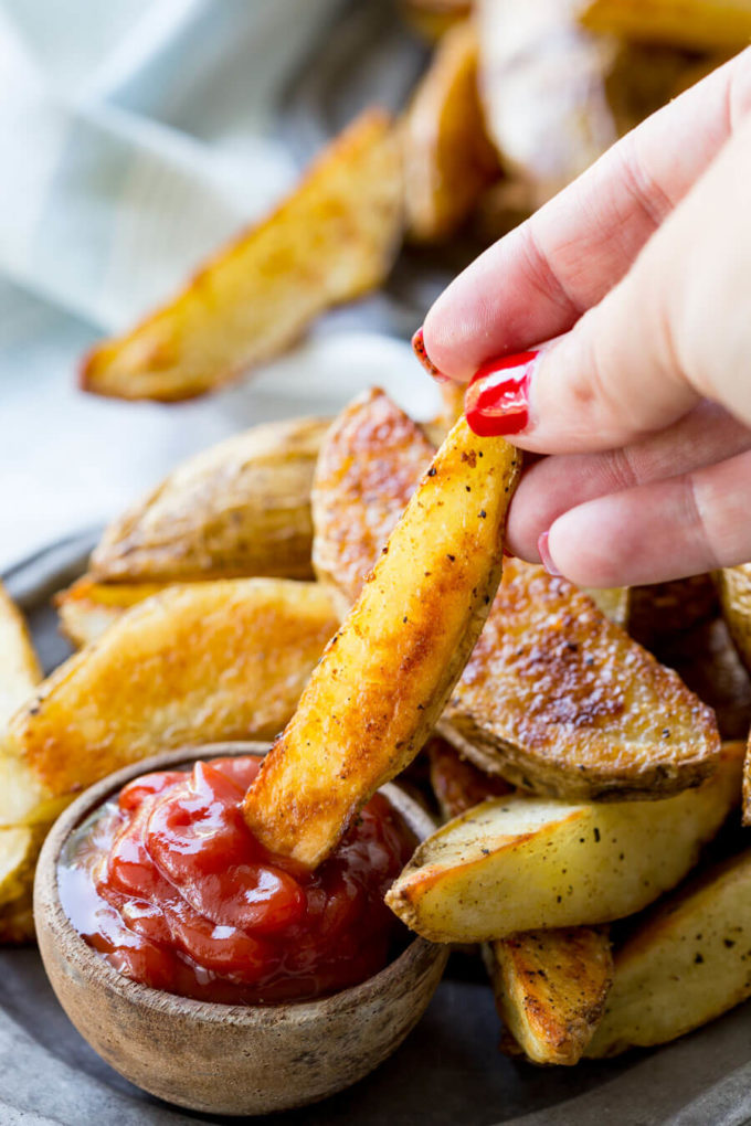 Baked Steak Fries: Crispy, crave-worthy, delicious steak fries that are baked, not fried. They have a nice crispy outer layer and the inside is melt in your mouth soft and delicious. This method is super easy, and produces great fries every time!