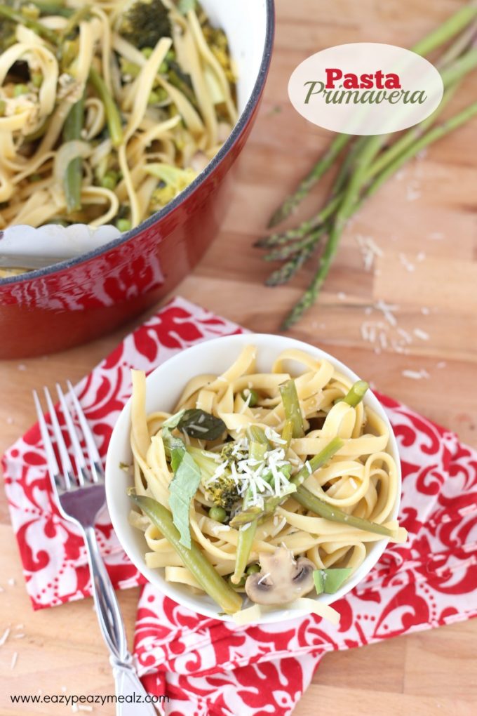 pasta primavera with red pot and a fork.