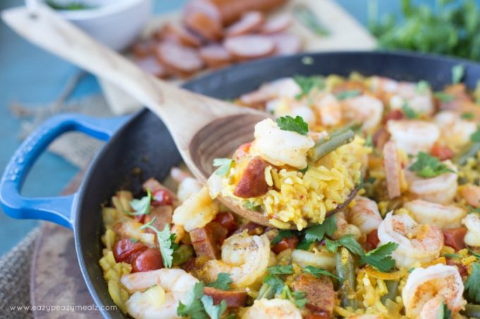 Spanish Paella: Saffron infused rice, hearty sausage, prawns, and fresh green beans! This Spanish Paella will take your tastebuds on a Valencian vacation.