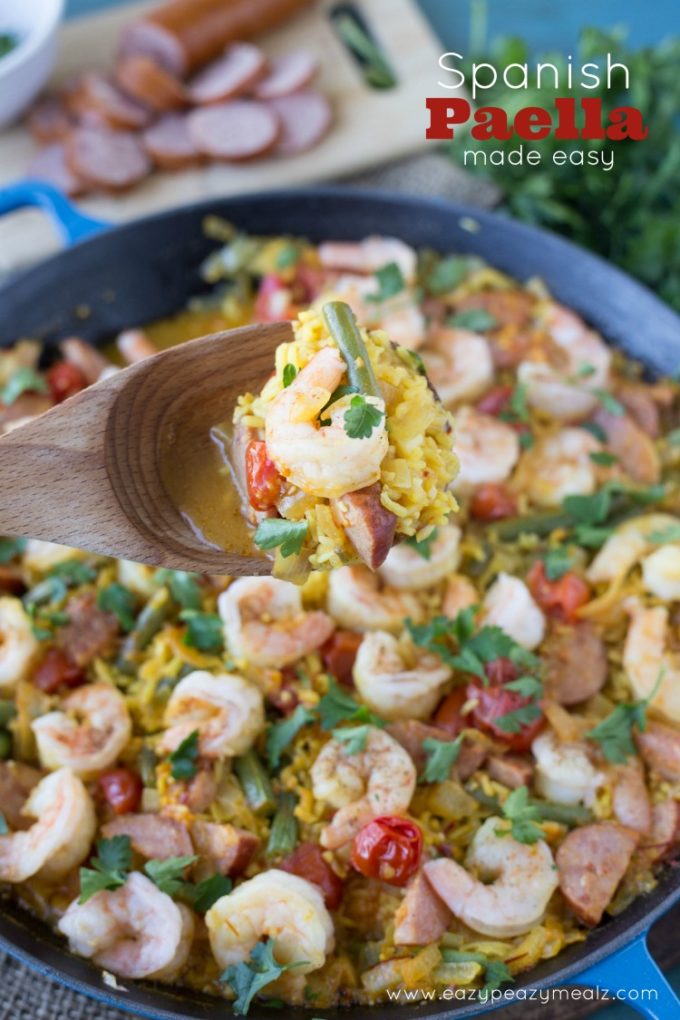 Spanish Paella: Saffron infused rice, hearty sausage, prawns, and fresh green beans! This Spanish Paella will take your tastebuds on a Valencian vacation.