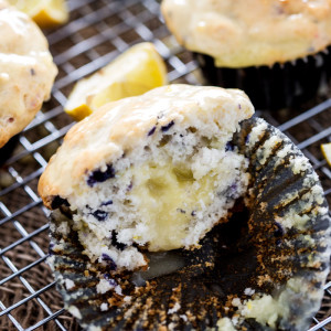 Sour Cream Lemon filled Blueberry Muffins, with sour cream lemon glaze. Utterly delectable.