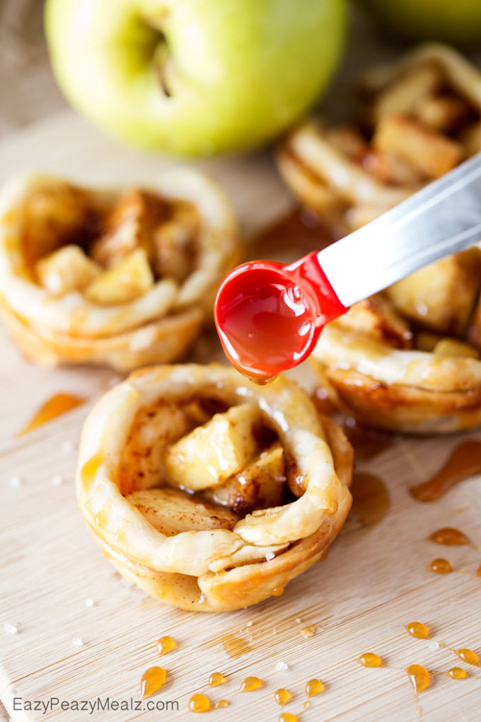 Caramel Apple Pie Bites: Little buttery, flaky pie bites, filled with apple and spices, and drizzled in caramel and salt!