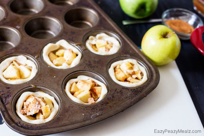 Muffin Tin Apple Pies: Little buttery, flaky pie bites, filled with apple and spices, and drizzled in caramel and salt!