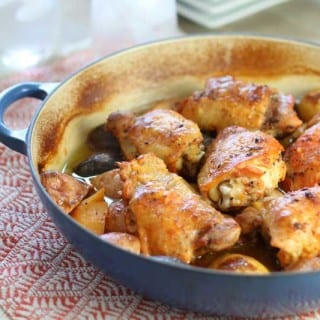 Baked chicken with lemon garlic creamy sauce in skillet