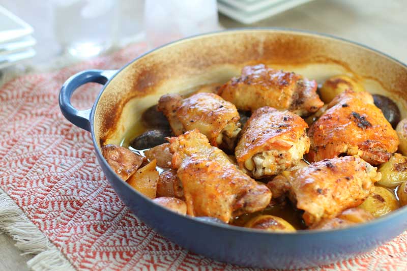 Baked chicken with lemon garlic creamy sauce in skillet