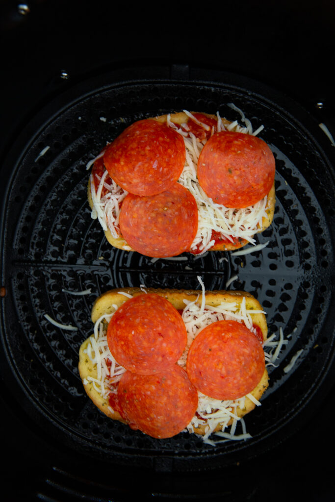 Building your Texas toast pizzas in the air fryer