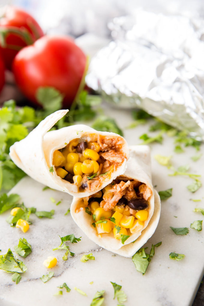 BBQ Chicken Burritos made with shredded chicken, your favorite BBQ sauce, topped with beans, corn or any of your favorite ingredients.