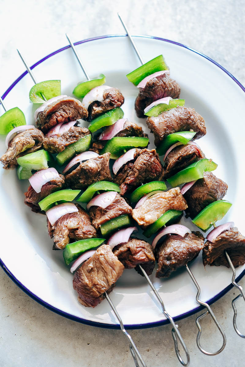 Beef skewer, mustard dressing and fried rosemary