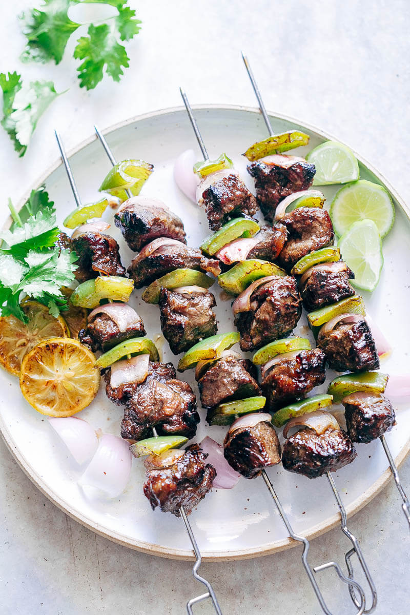 Beef skewer, mustard dressing and fried rosemary