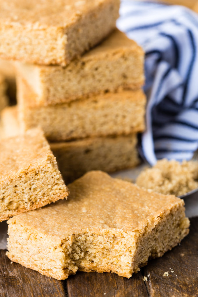 A stack of brown sugar bars, the bottom one has a bite taken out of it