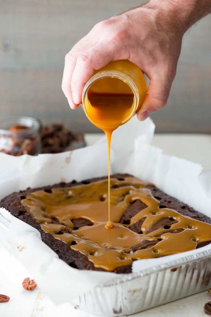 Pour on the caramel to this easy turtle poke cake!
