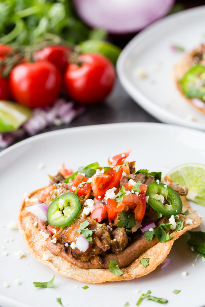 Crispy Carnitas Tostadas loaded with all the good stuff. 