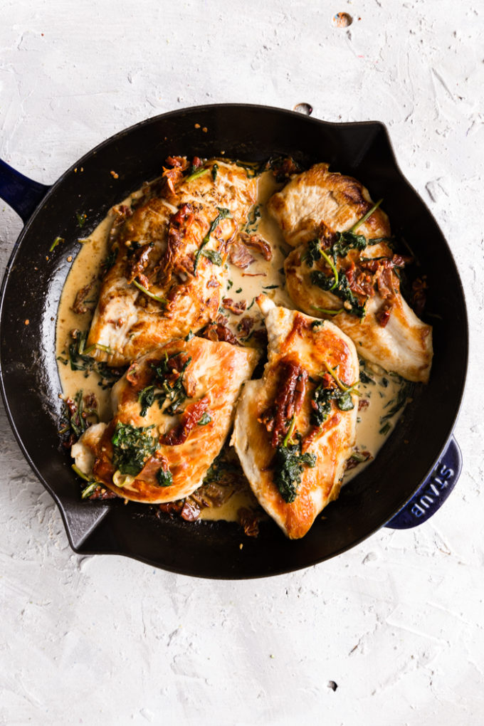 Creamy Tuscan Chicken, cooked in a skillet.