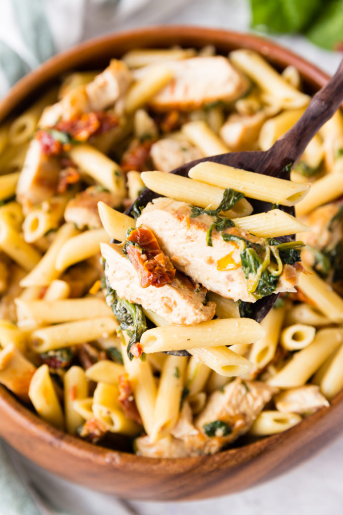 A delicious scoop of creamy tuscan chicken penne pasta