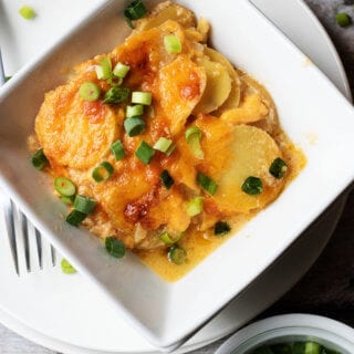 Easy Cheesy Scalloped Potatoes topped with Green Onions