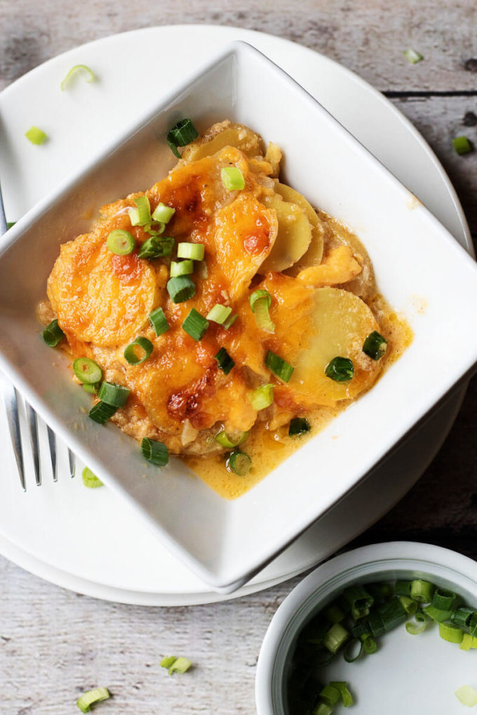 Easy Cheesy Scalloped Potatoes topped with Green Onions