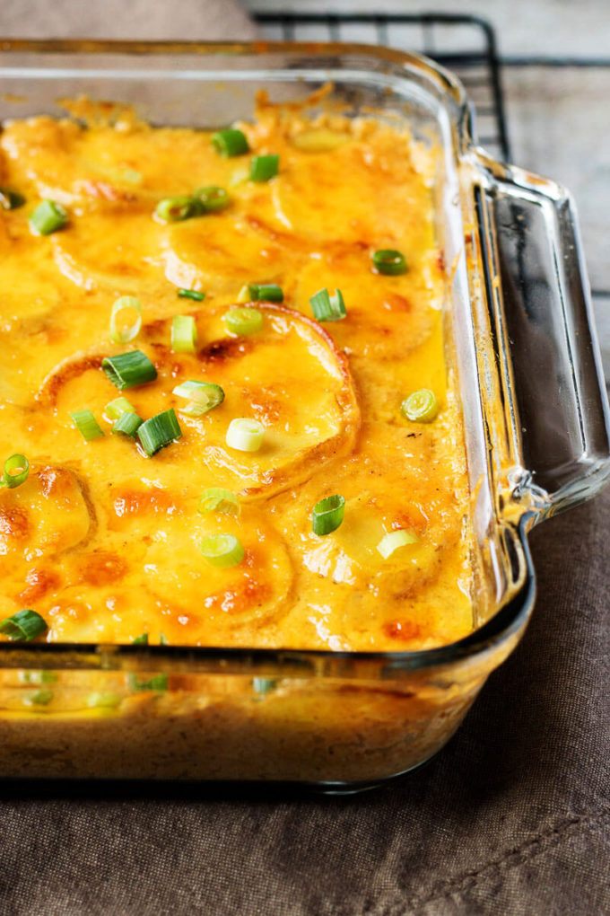 Easy Cheesy Scalloped Potatoes topped with Green Onions