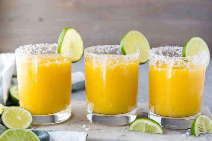 All lined up, frozen mango margaritas