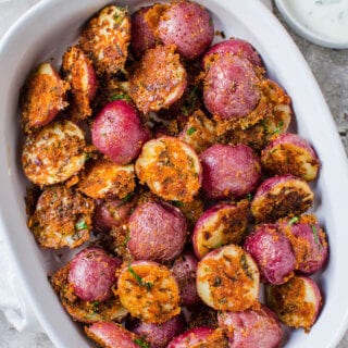 These garlic parmesan roasted potatoes are a delicious side dish or appetizer that you can make in no time. Quick prep time with tons of flavors.