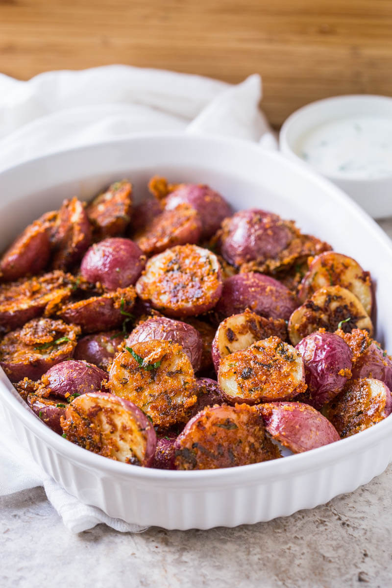 These garlic parmesan roasted potatoes are a delicious side dish or appetizer that you can make in no time. Quick prep time with tons of flavors.