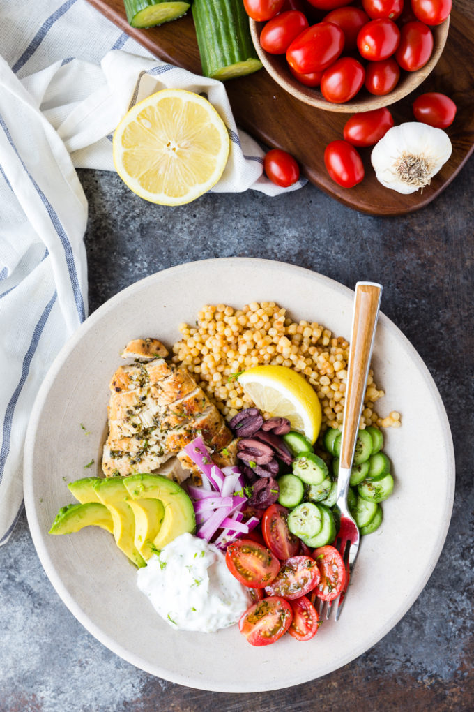 A lovely greek chicken bowl with Kalamata olives, avocado, tomato, cucumber and more. 