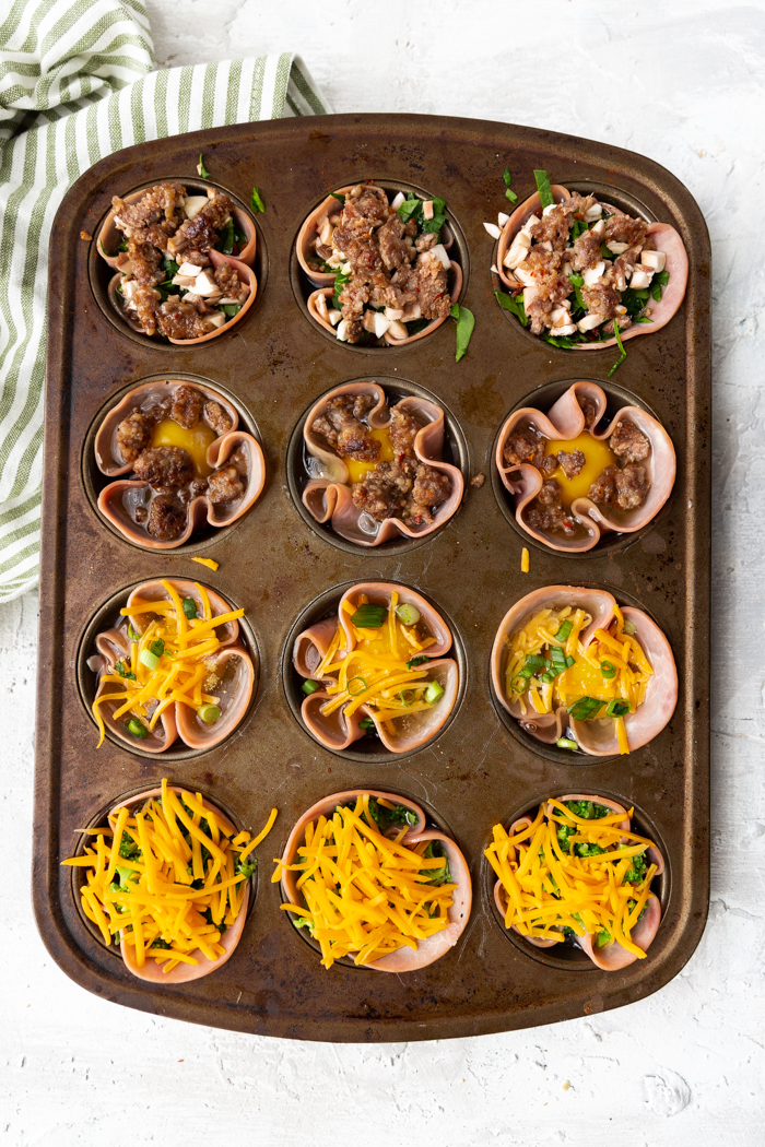 Ham and egg cups with sausage.