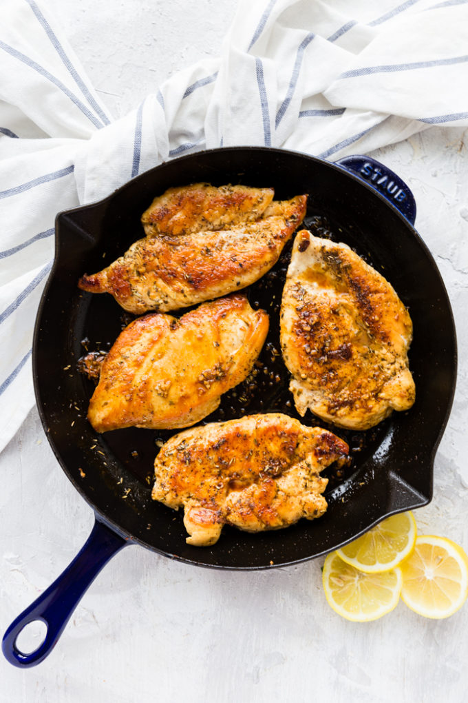 Healthy skillet lemon chicken, cooked to perfection in a cast iron skillet