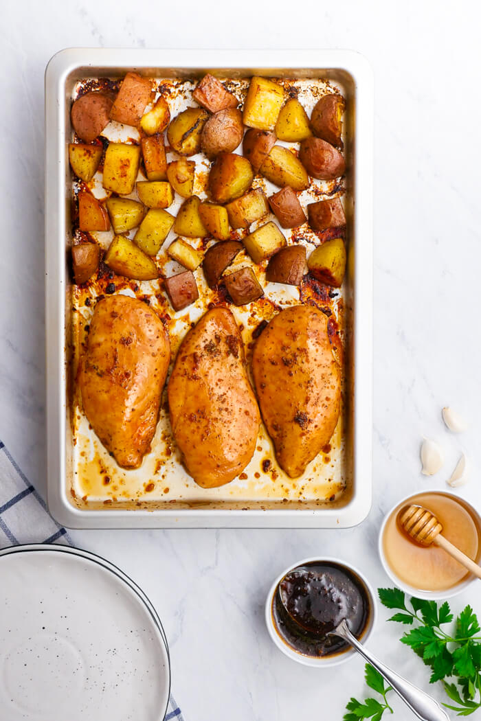 Honey Garlic Chicken and potatoes, cooked on a single sheet pan