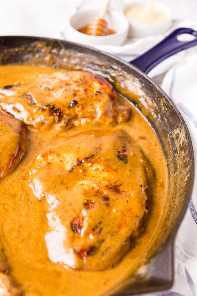 Honey dijon mustard chicken in a skillet