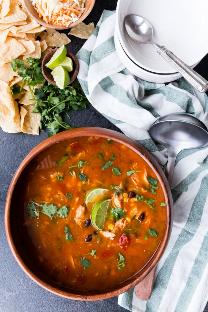 Instant Pot Chicken Taco Soup is a rich and flavorful broth and all the fixings like chicken, beans, and corn