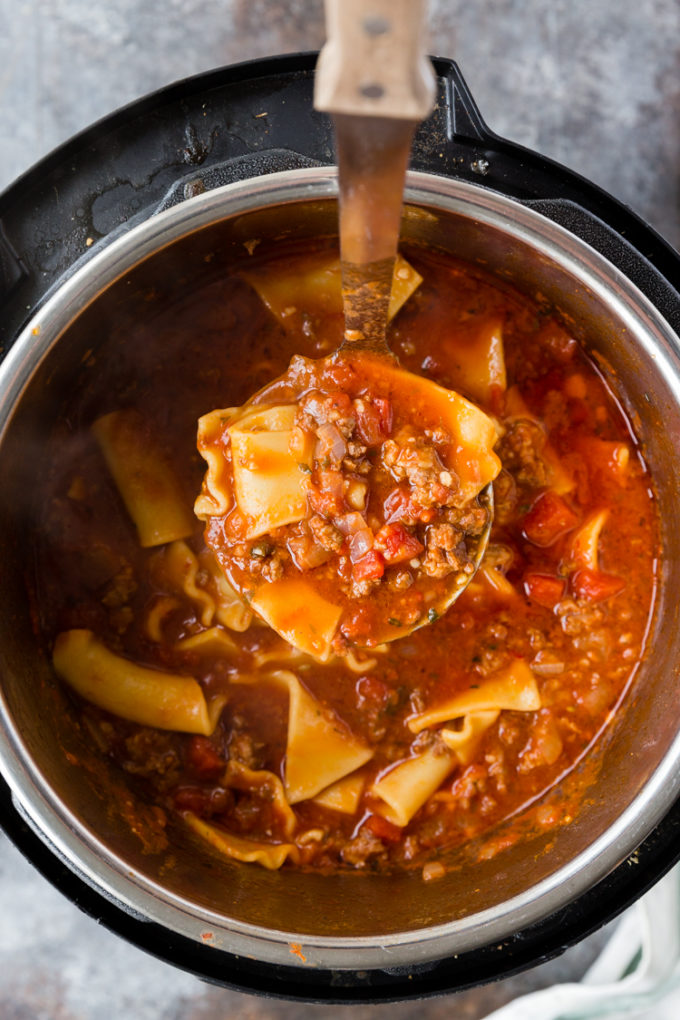 Making instant pot lasagna soup cooked in the pressure cooker