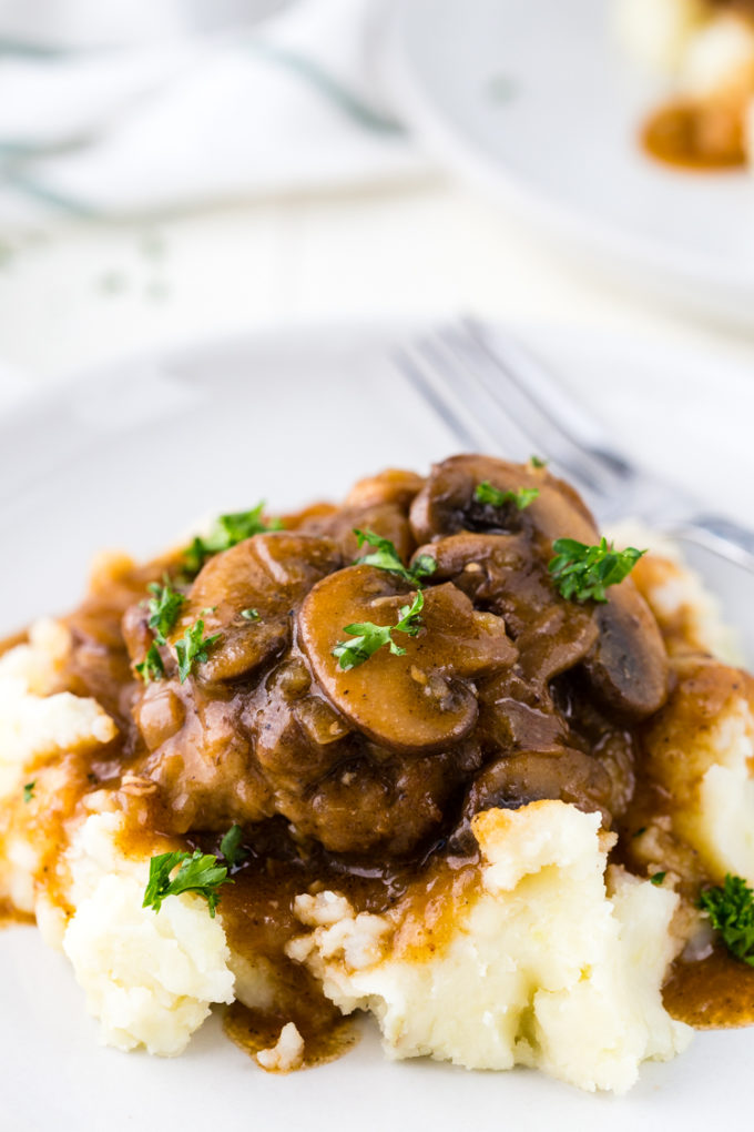 Instant Pot Salisbury steak with Mushroom Gravy, a delicious meal cooked in the pressure cooker. 