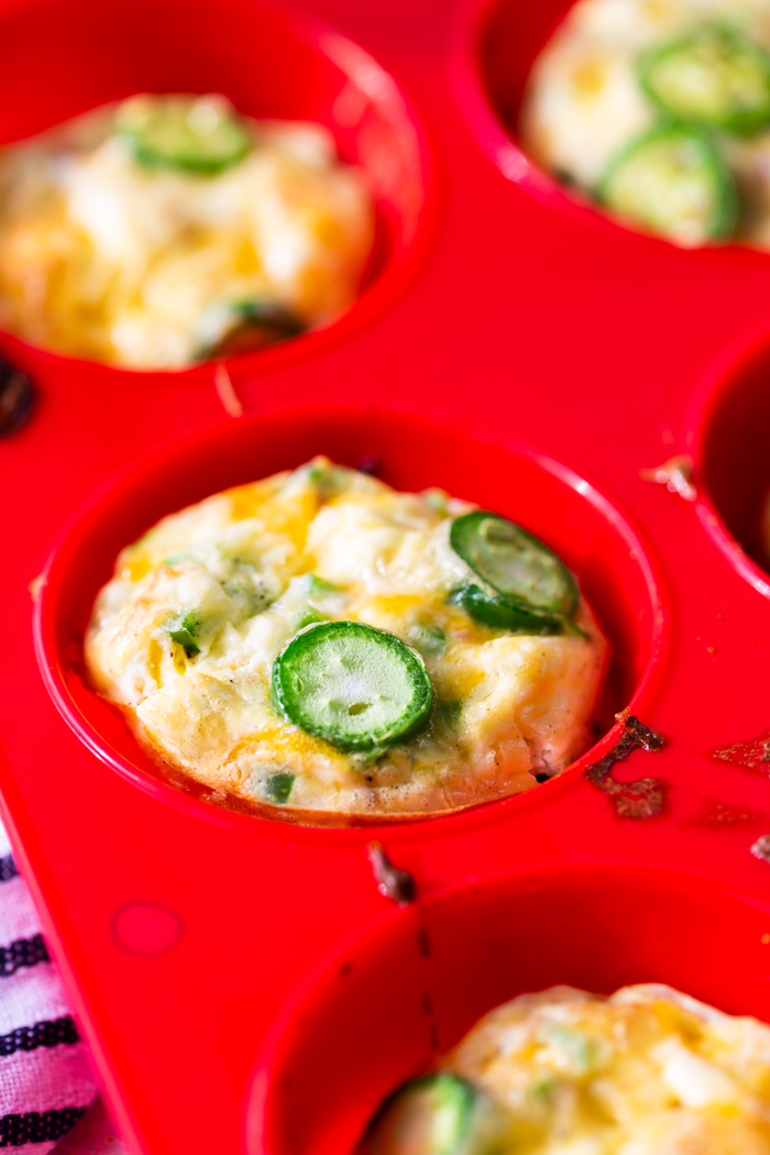 Jalapeno popper egg cups in a silicone baking tin