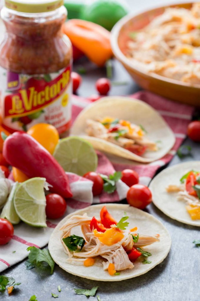 Mango Habanero chicken tacos cooked in the slow cooker. These are so easy!