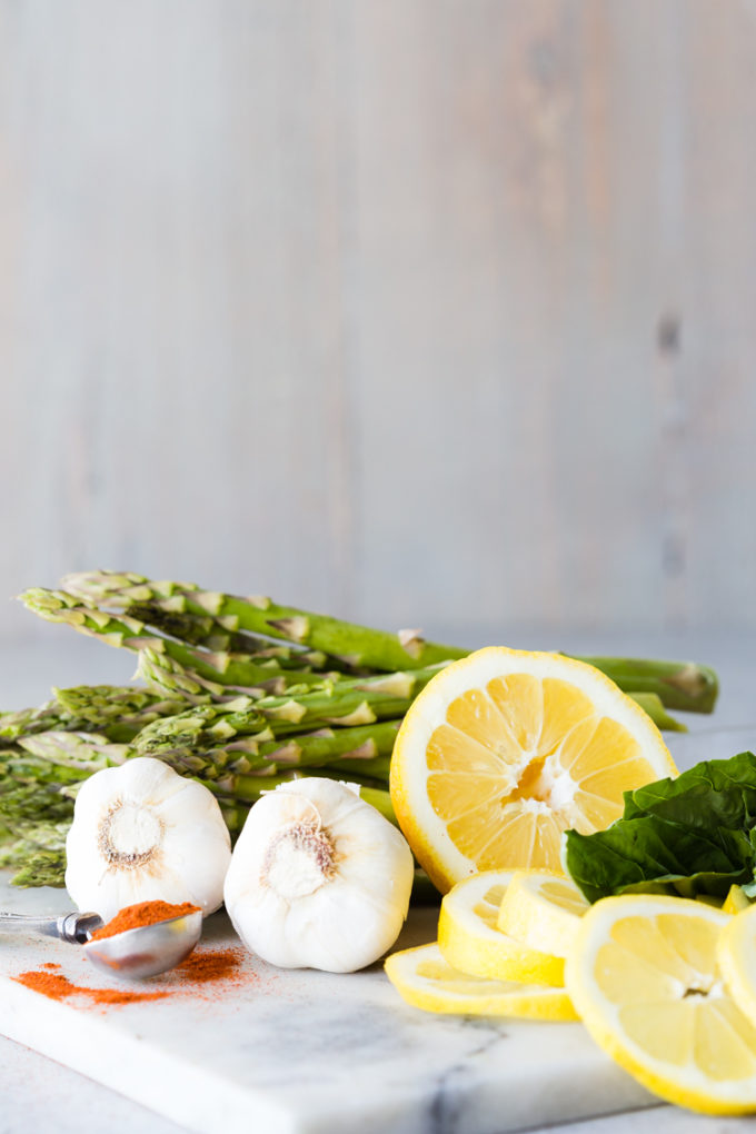 Everything you need to make delicious lemon butter salmon foil packets, baked with asparagus