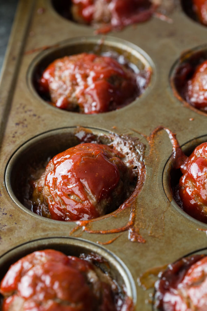Individual Meatloaf Minis are packed with flavor, made in a muffin tin for thorough cooking and easy serving, and rivals any meatloaf out there!
