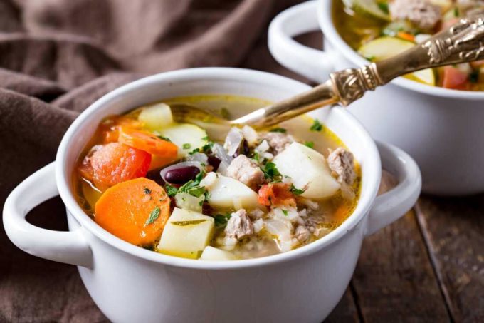 A bowl of heaping and hearty ministrone soup