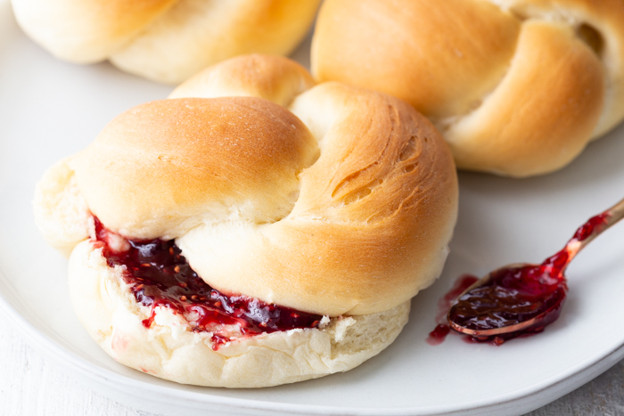 Delicious and beautiful dinner rolls with butter and jam