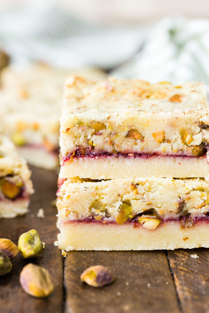 Two raspberry pistachio shortbread bars