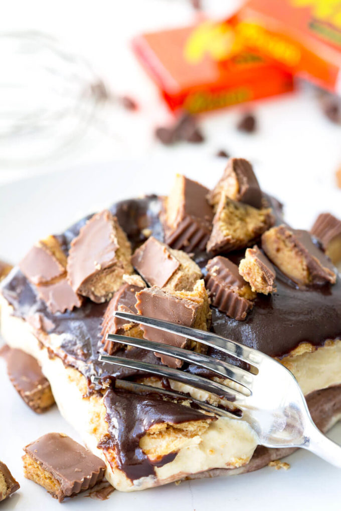 Reese's Ice Box Cake, layers of sweets covered in hot fudge sauce and peanut butter goodness